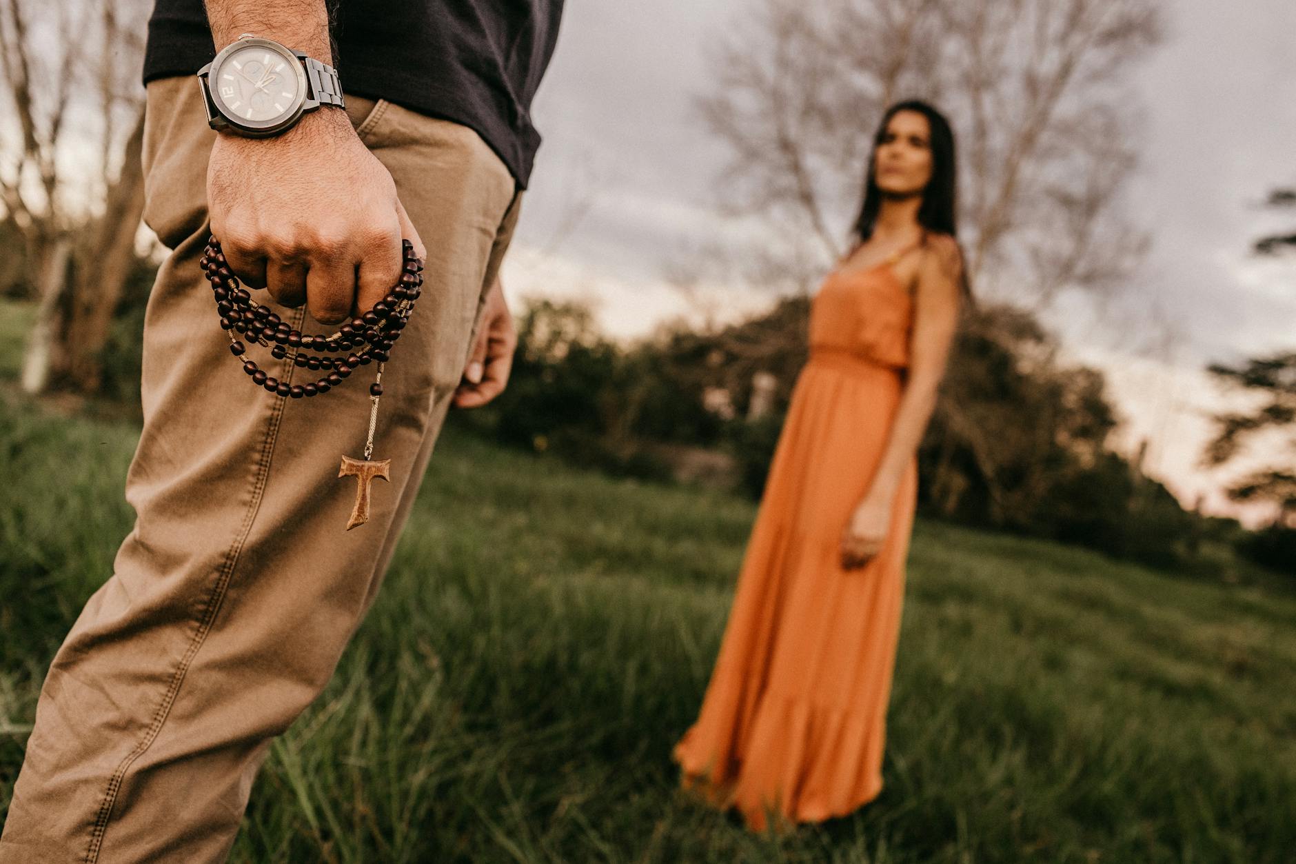 Two people holding hands in soft golden light representing the partnership and new beginnings of the 1122 angel number