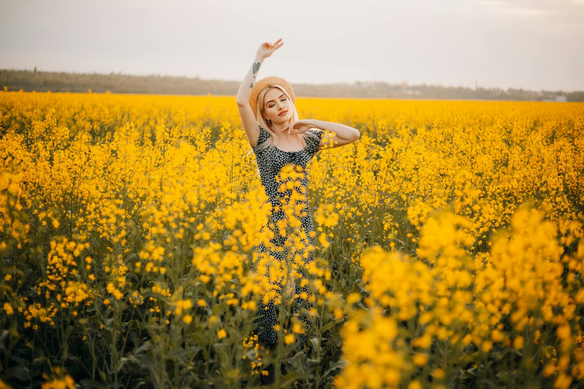 Woman with a confident expression surrounded by golden light representing the abundance and new prosperity of the 1818 angel number