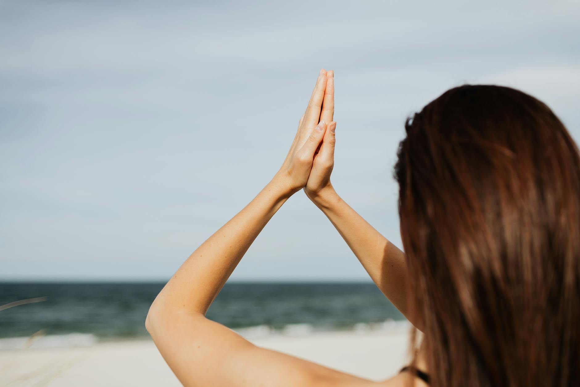 Woman meditating in serene stillness representing the trust and surrender energy of angel number 2000