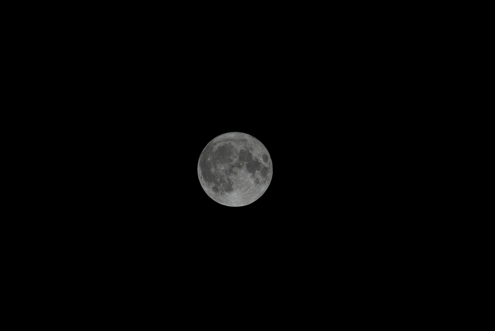 Full moon rising over a still sea — representing the profound sacred completion and Master Builder energy of angel number 2929
