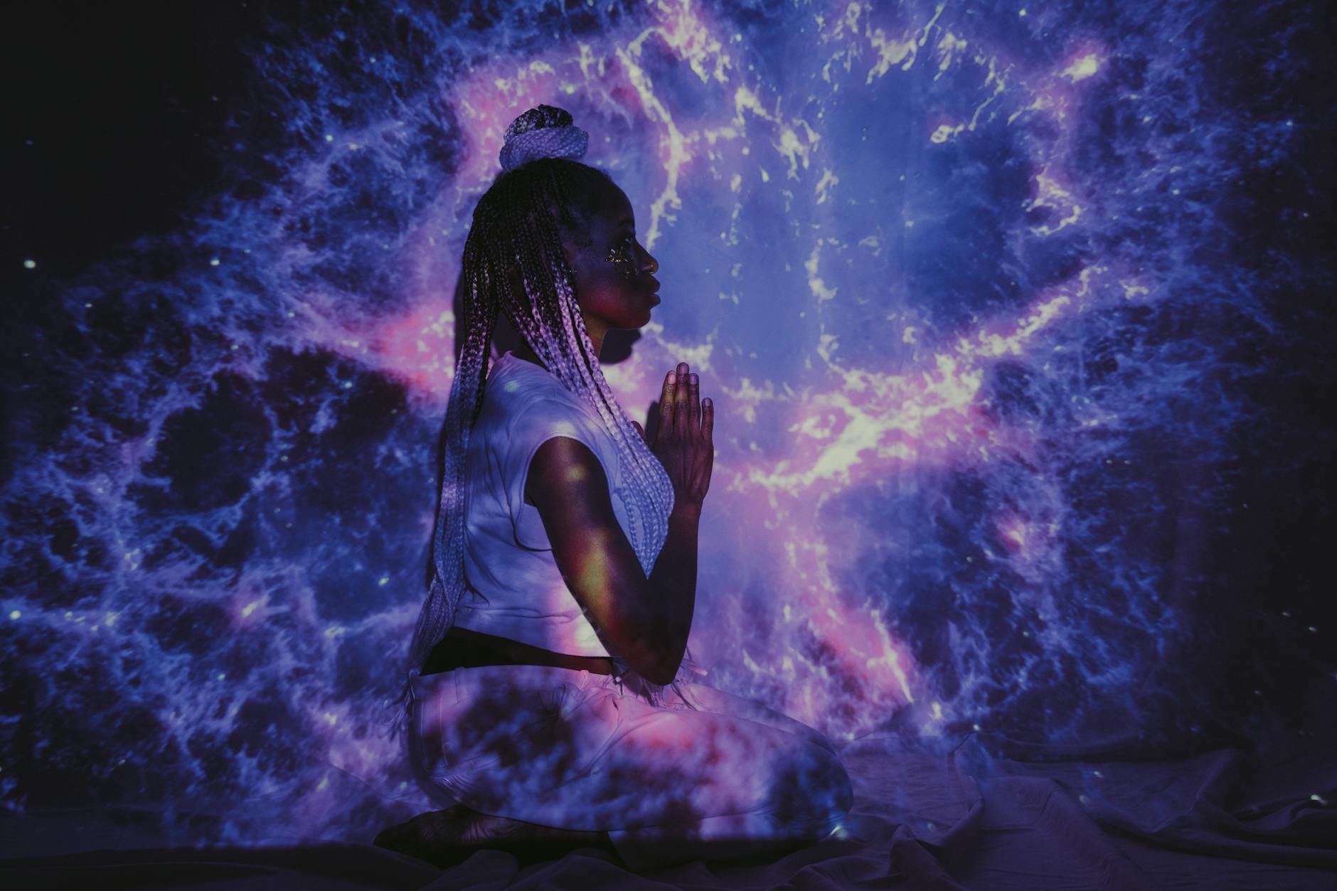 Woman meditating in golden light representing the 333 angel number message