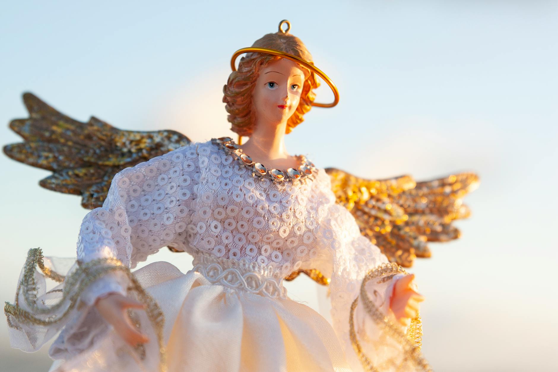 Woman standing in warm golden light with a sense of total peace representing the complete angelic protection of the 4444 angel number